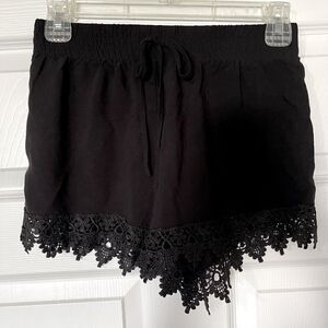 EUC Super cute black shorts with lace trim.